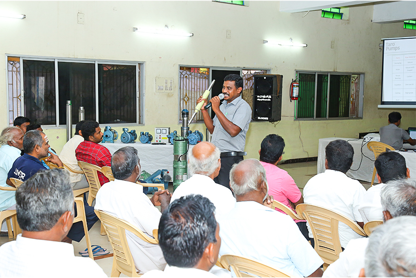 Taro Pumps sales manager explaining Taro Pumps products to mechanics