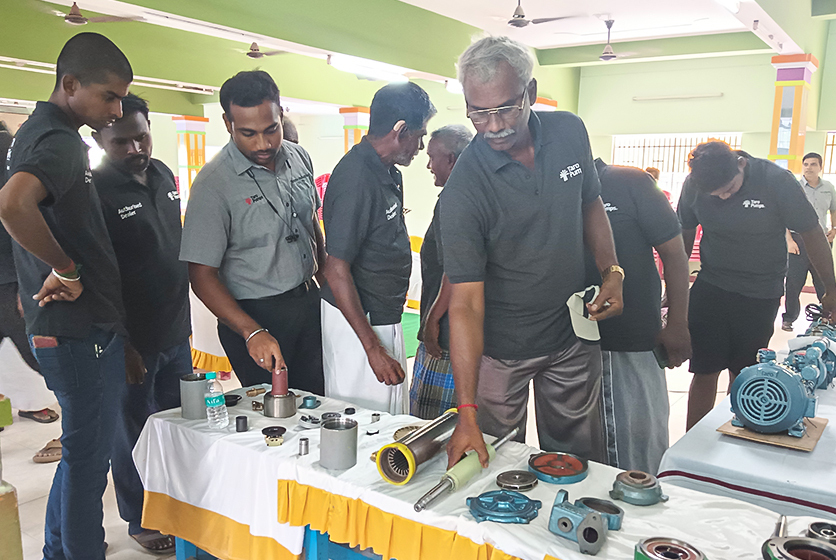 Taro Pumps manager explaining Taro Pumps products to mechanics