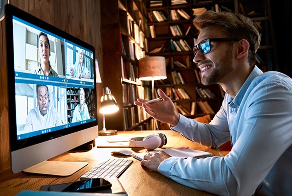 Businessman having virtual team meeting