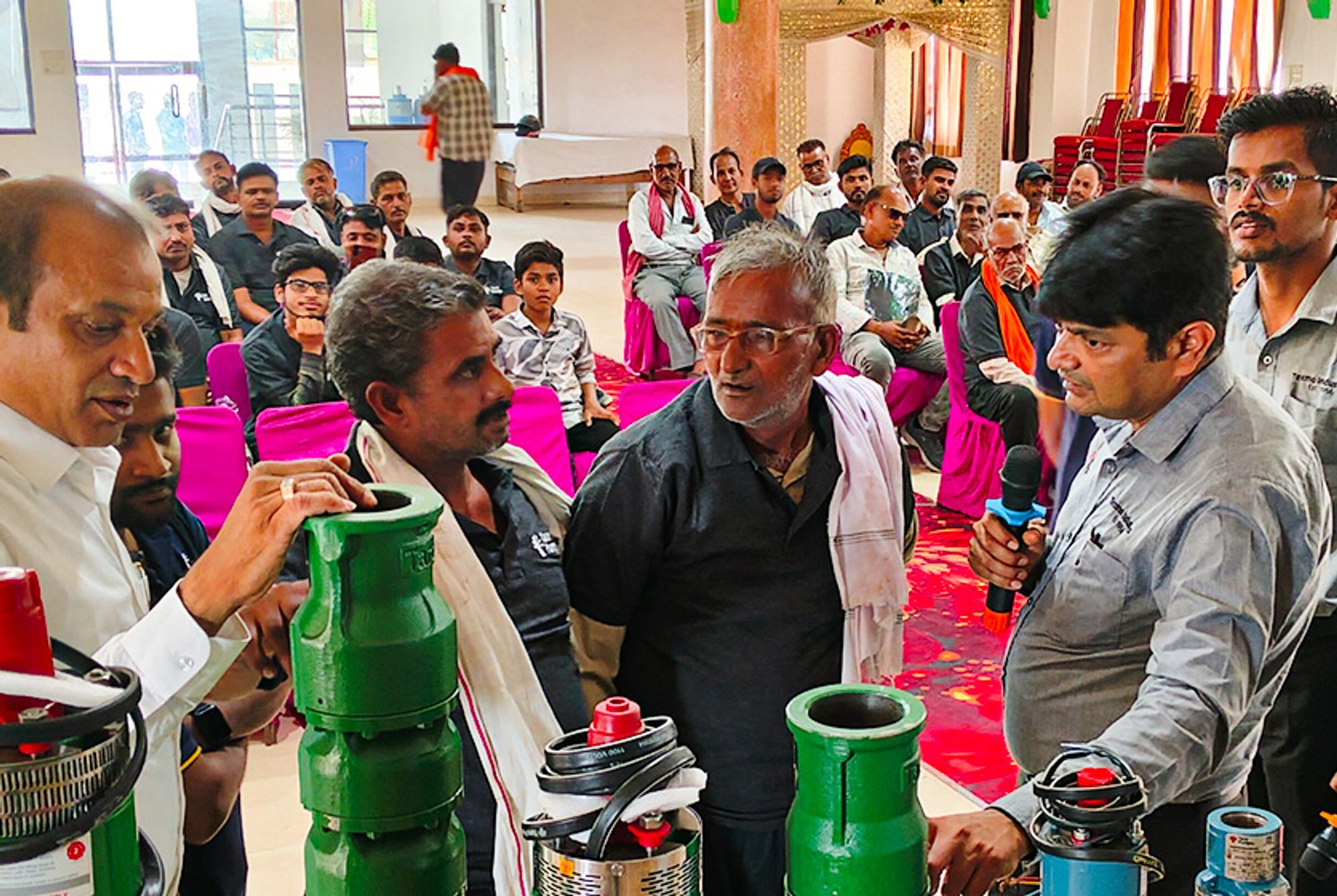 Taro Pumps manager explaining Taro Pumps products to mechanics