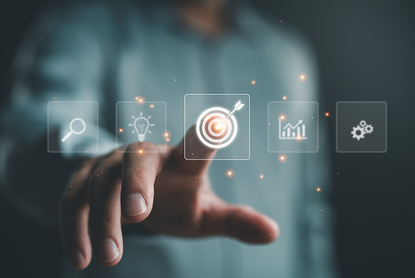 Finger pointing to a digital representation of business trends, goals, targets and analysis